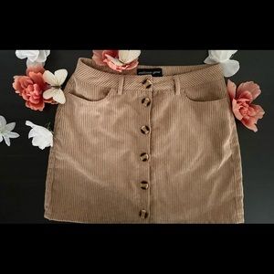 Stylish tan/khaki corduroy mini skirt. Size S.